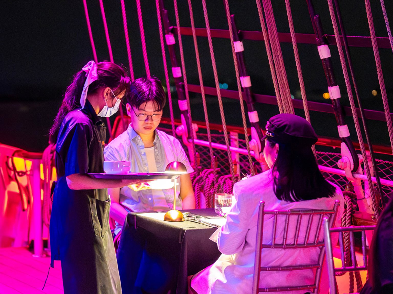 Dinner being served on deck of the Royal Albatross