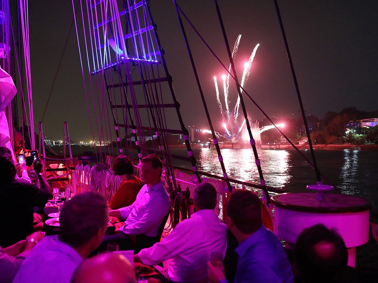 Fireworks seen from the deck between the masts